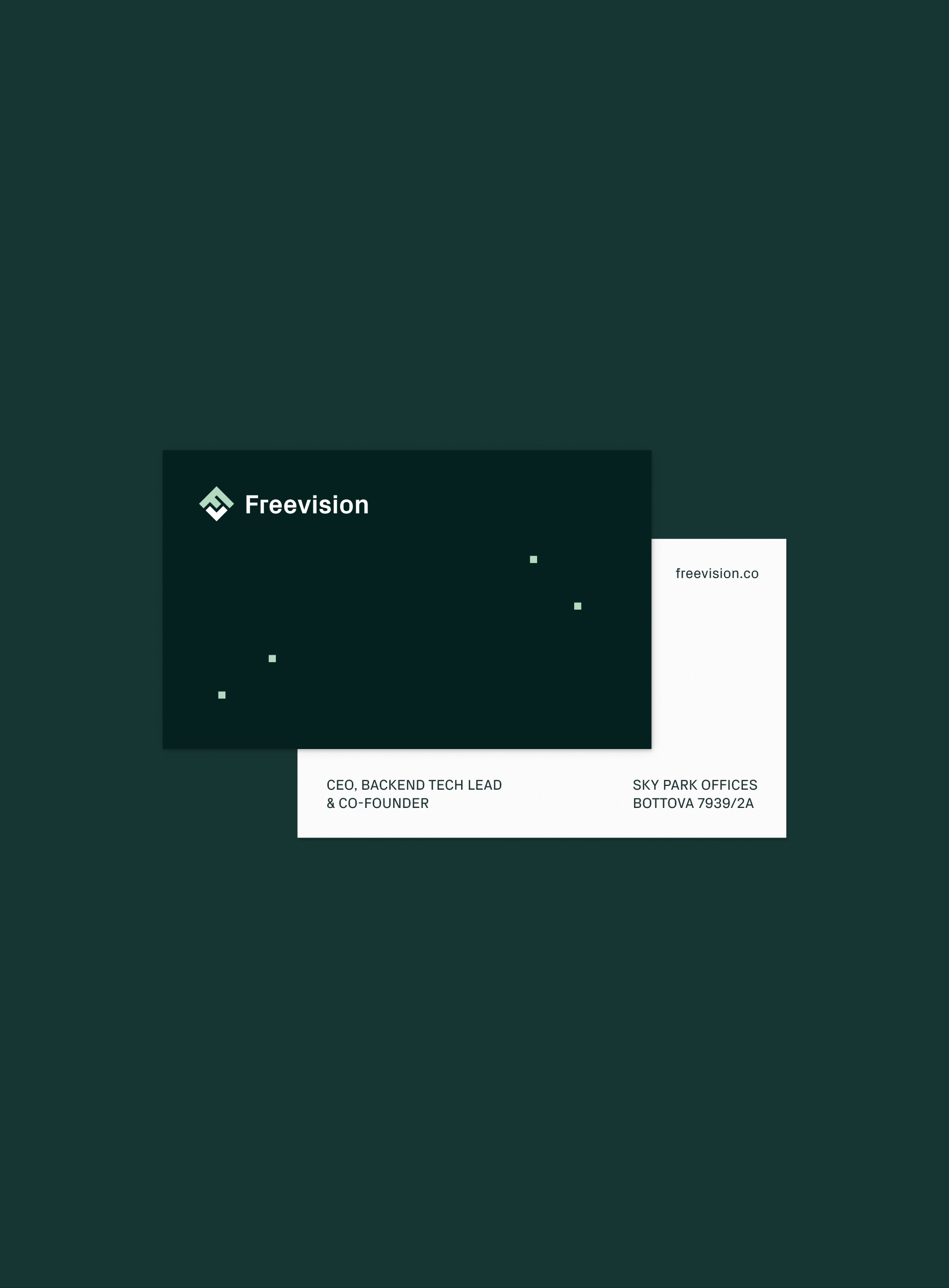 Business cards on dark green
